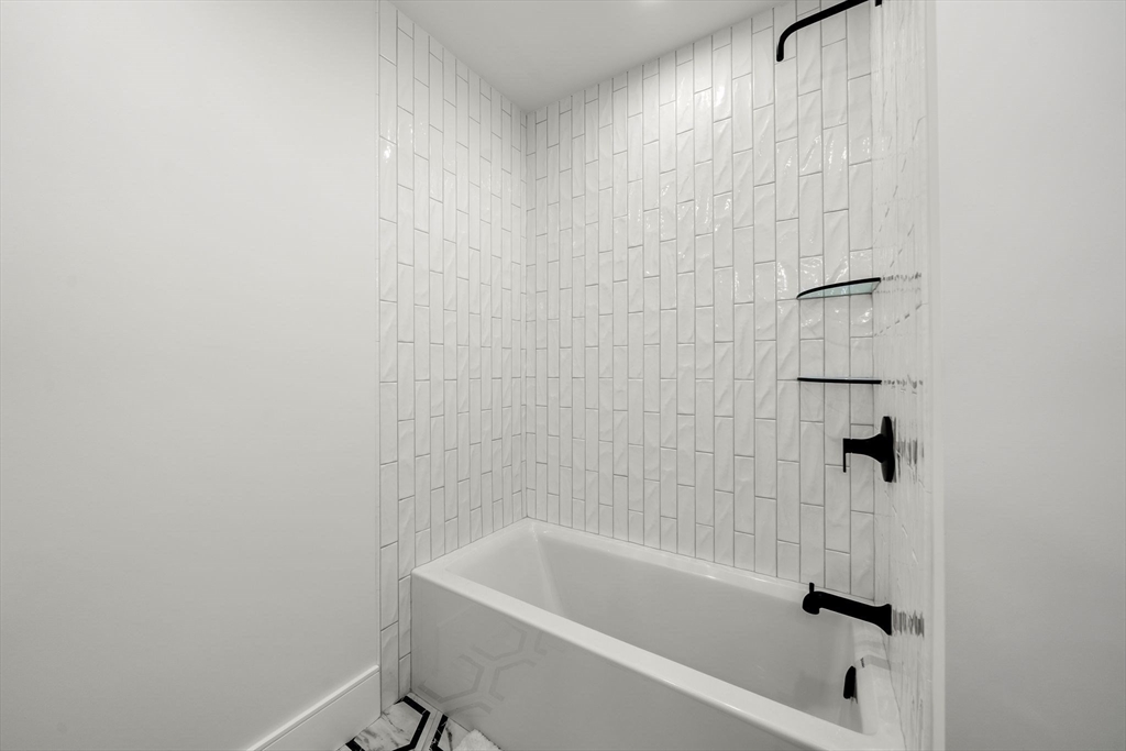 136 West 8th Street, Unit 2 Boston, MA 02127 - Photo 13 of 14 a bathroom with a bathtub