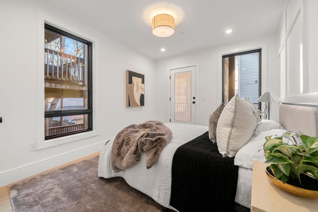 136 West 8th Street, Unit 2 Boston, MA 02127 - Photo 8 of 14 a bedroom with bed and a window