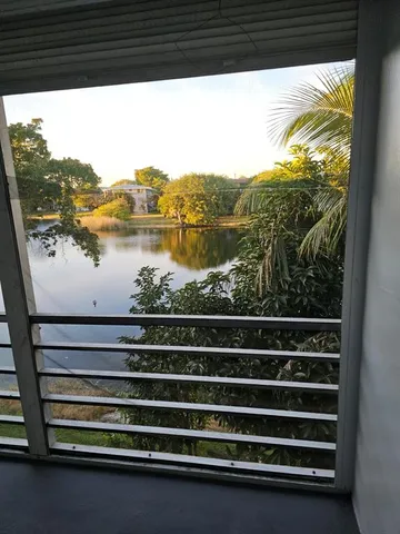 a view of swimming pool from a balcony