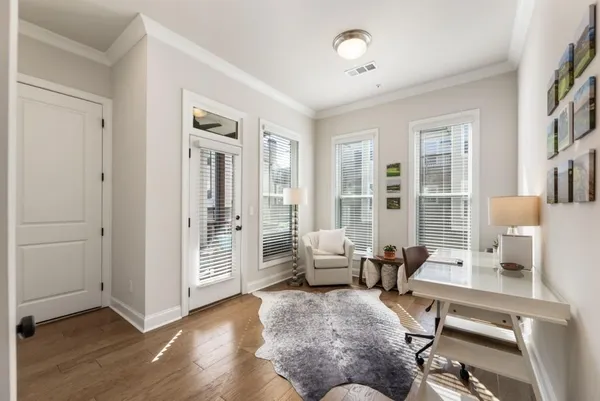 a living room with furniture and a table