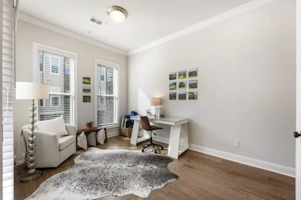 a living room with furniture rug and window