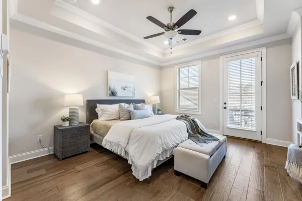 a spacious bedroom with a bed and a couch