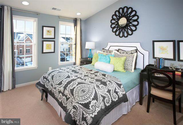 4506 Grazing Way Upper Marlboro, MD 20772 - Photo 2 of 12 a bedroom with a bed and wooden floor