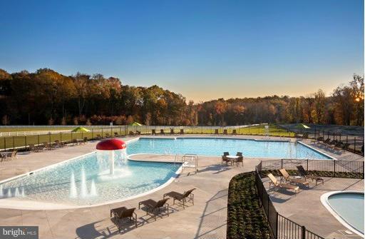 4506 Grazing Way Upper Marlboro, MD 20772 - Photo 12 of 12 a view of a swimming pool with a patio and a yard