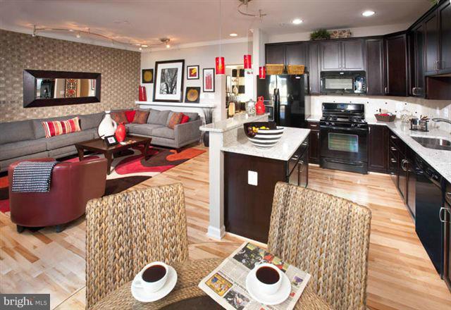 4506 Grazing Way Upper Marlboro, MD 20772 - Photo 3 of 12 a kitchen with a refrigerator and a stove top oven