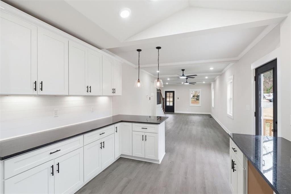 285 3rd Street East Fruithurst, AL 36262 - Photo 18 of 53 a view of a kitchen with cabinets and wooden floor