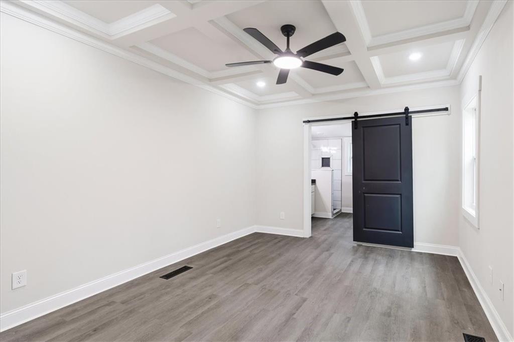 285 3rd Street East Fruithurst, AL 36262 - Photo 24 of 53 an empty room with wooden floor and windows