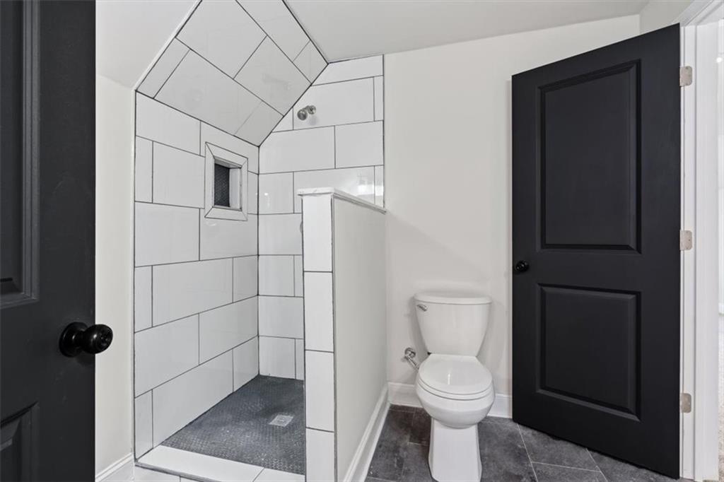 285 3rd Street East Fruithurst, AL 36262 - Photo 36 of 53 a bathroom with a toilet and a shower