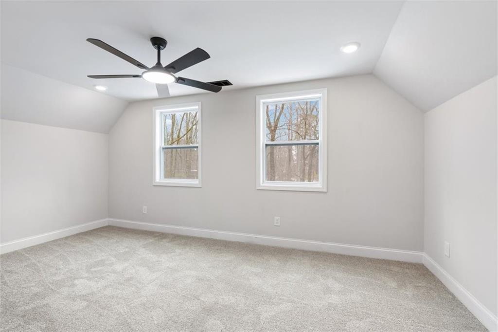 285 3rd Street East Fruithurst, AL 36262 - Photo 38 of 53 an empty room with ceiling fan and windows