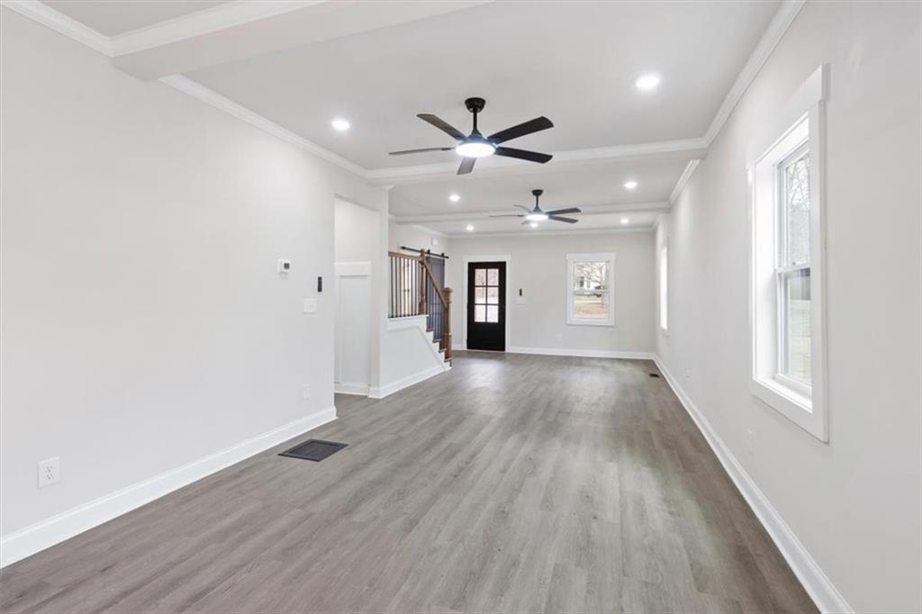 285 3rd Street East Fruithurst, AL 36262 - Photo 9 of 53 wooden floor in an empty room with a window