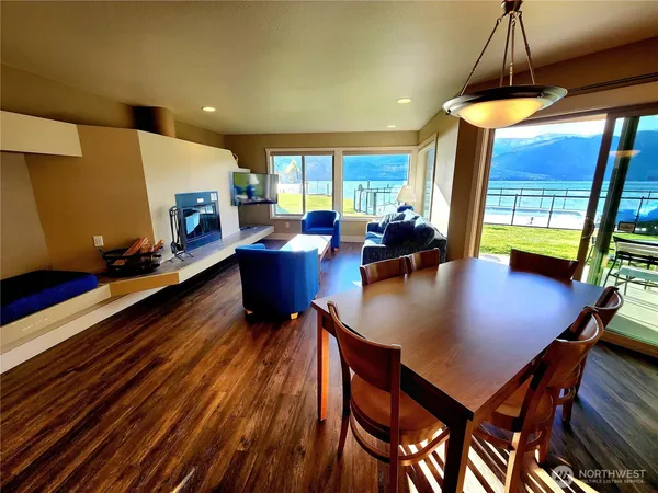 a living room with dining room and a table