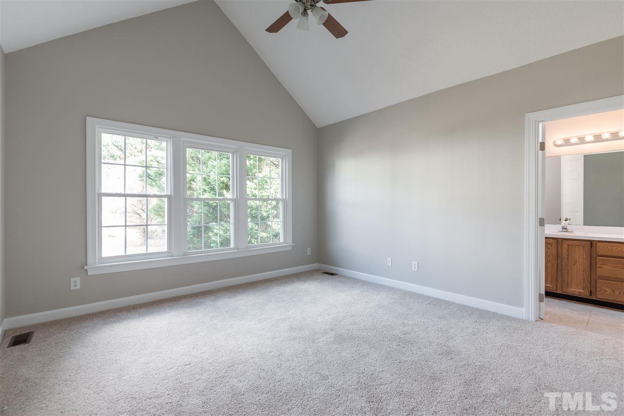 4237 Dinwiddie Court Raleigh, NC 27604 - Photo 16 of 25 an empty room with windows and cabinet