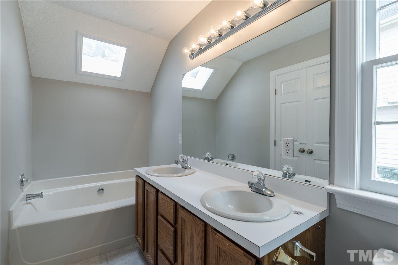 4237 Dinwiddie Court Raleigh, NC 27604 - Photo 18 of 25 a bathroom with a sink and a bathtub