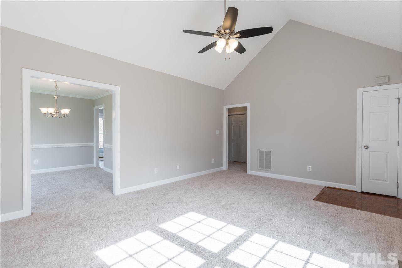 4237 Dinwiddie Court Raleigh, NC 27604 - Photo 7 of 25 an empty room with fan and windows