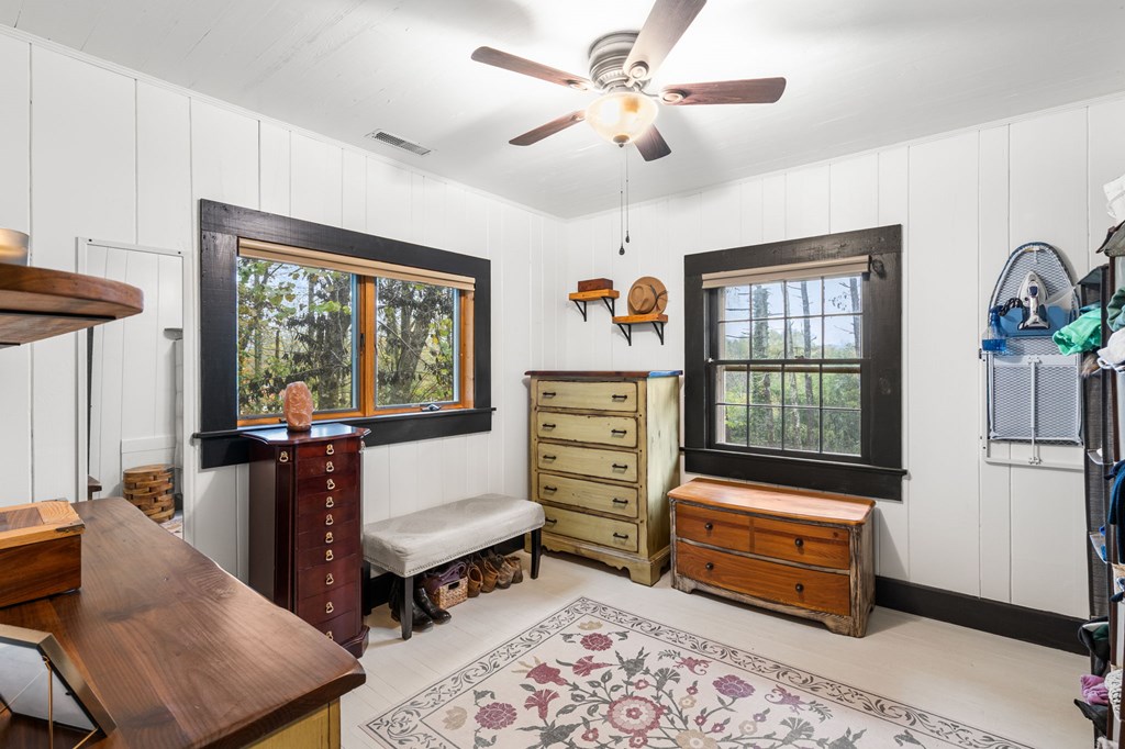 106 Settawig Road Brasstown, NC 28902 - Photo 19 of 100 a bedroom with furniture and a window