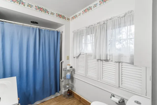 a view of a patio with table and chairs potted plants