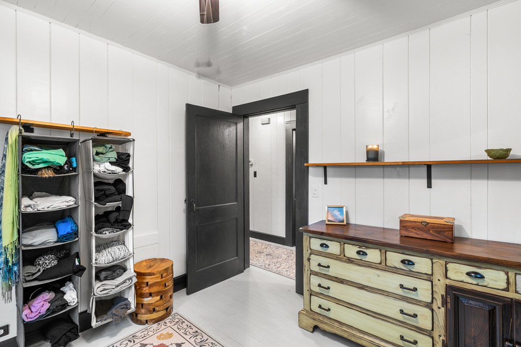 106 Settawig Road Brasstown, NC 28902 - Photo 29 of 100 a view of walk in closet with clothes and shoes