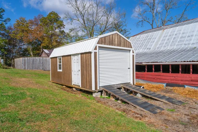 a living room with furniture a rug and a chandelier