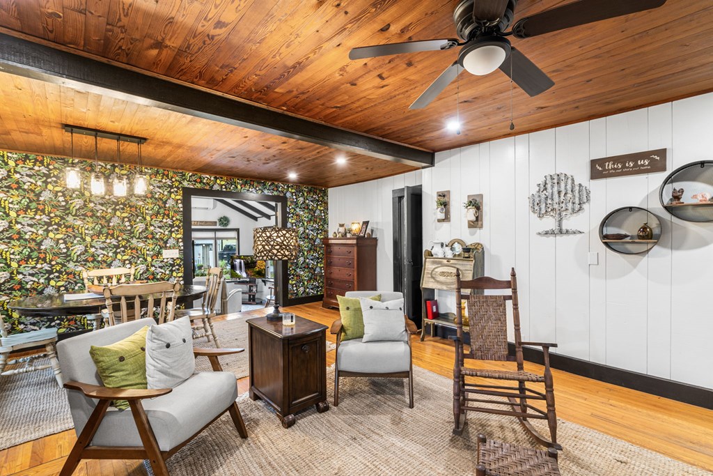 106 Settawig Road Brasstown, NC 28902 - Photo 6 of 100 a living room with patio furniture and a large window