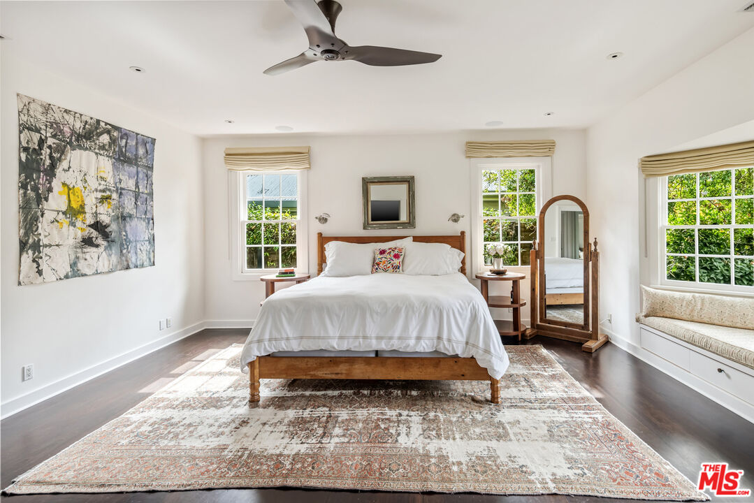 7 Latimer Road Santa Monica, CA 90402 - Photo 15 of 37 a spacious bedroom with a bed a couch and a window