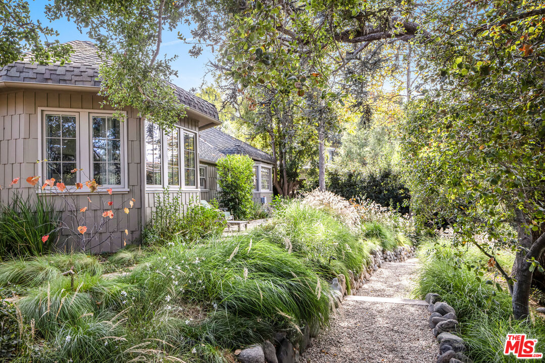 7 Latimer Road Santa Monica, CA 90402 - Photo 24 of 37 front view of a house with a yard and potted plants