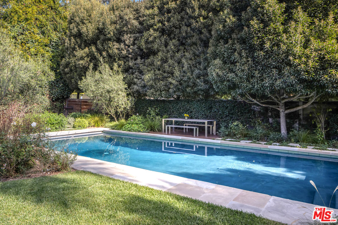 7 Latimer Road Santa Monica, CA 90402 - Photo 27 of 37 a view of yard with swimming pool and trees in the background