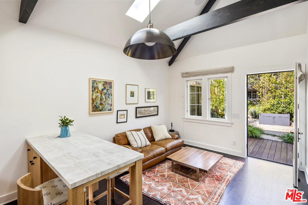 7 Latimer Road Santa Monica, CA 90402 - Photo 29 of 37 a living room with furniture and a large window