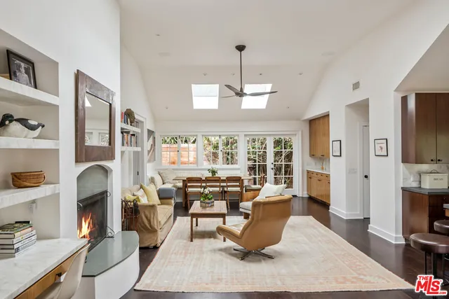 a living room with fireplace furniture and a flat screen tv