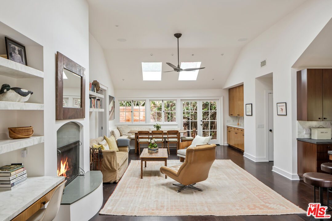 7 Latimer Road Santa Monica, CA 90402 - Photo 6 of 37 a living room with fireplace furniture and a flat screen tv