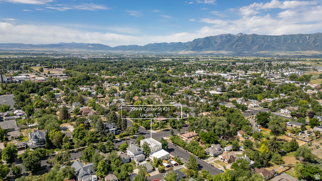 299 West Center Street, Unit 2 Logan, UT 84321 - Photo 43 of 46 Aerial perspective showcasing a residential area with varied architectural styles and mature trees