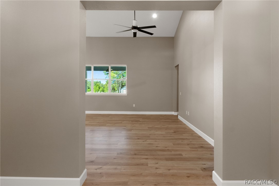 4530 South Florida Avenue Inverness, FL 34450 - Photo 6 of 100 an empty room with a window and a ceiling fan