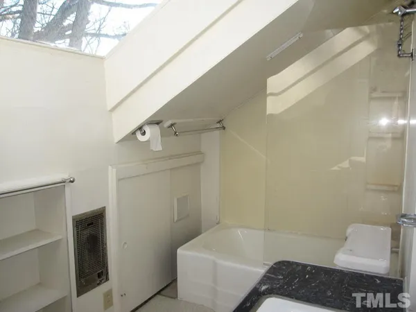 a bathroom with a sink and a bathtub