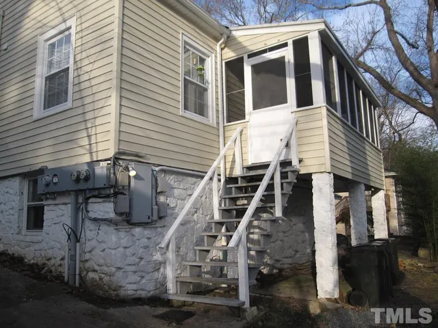 a view of a house with iron stairs