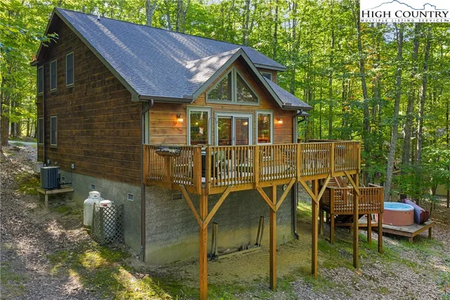 a view of a chairs and table in the backyard