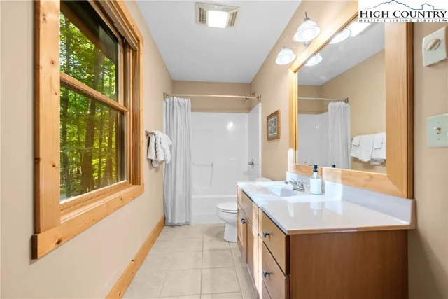 a bathroom with a sink vanity and a mirror