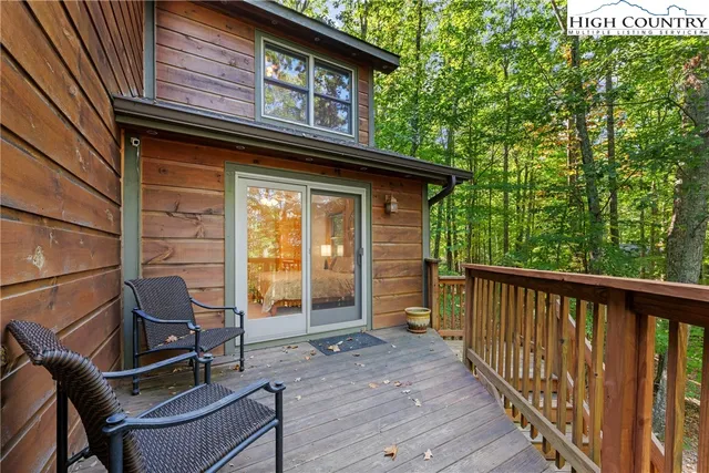 a view of a balcony with chairs