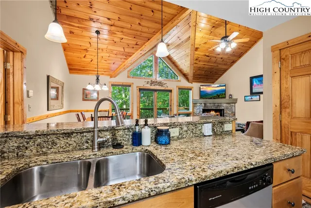 a kitchen with a sink and a large window