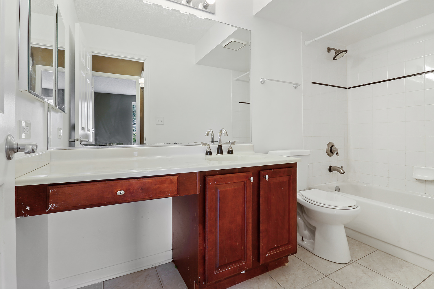 470 Fawell Boulevard, Unit 320 Glen Ellyn, IL 60137 - Photo 12 of 15 a spacious bathroom with a toilet sink and mirror