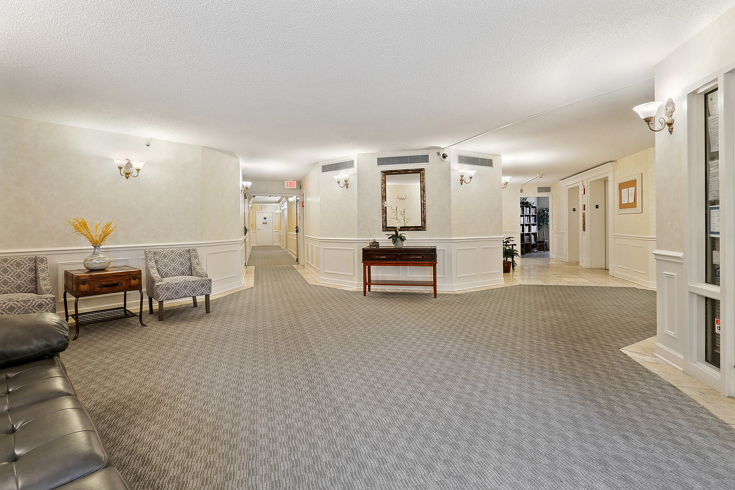 470 Fawell Boulevard, Unit 320 Glen Ellyn, IL 60137 - Photo 14 of 15 a living room with furniture and a table