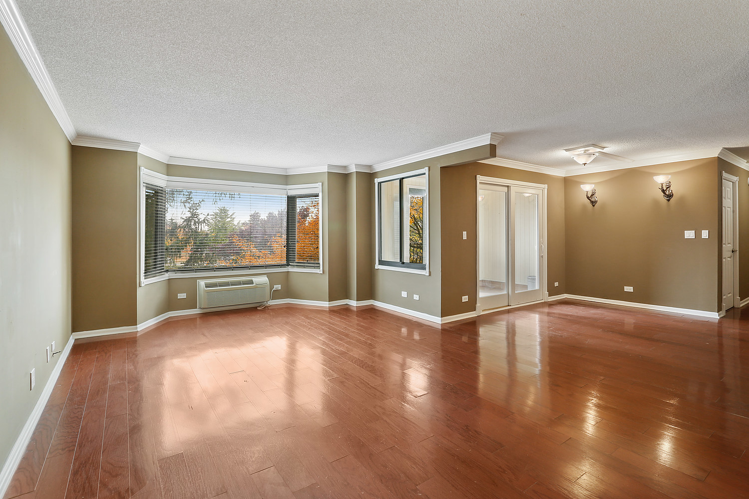 470 Fawell Boulevard, Unit 320 Glen Ellyn, IL 60137 - Photo 2 of 15 a view of an empty room with a window and wooden floor