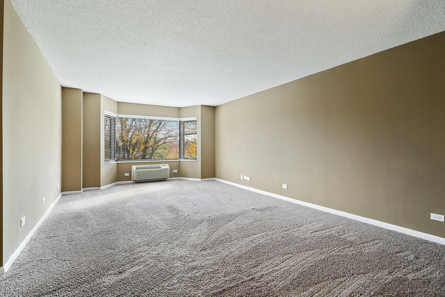 470 Fawell Boulevard, Unit 320 Glen Ellyn, IL 60137 - Photo 7 of 15 a view of an empty room with a window