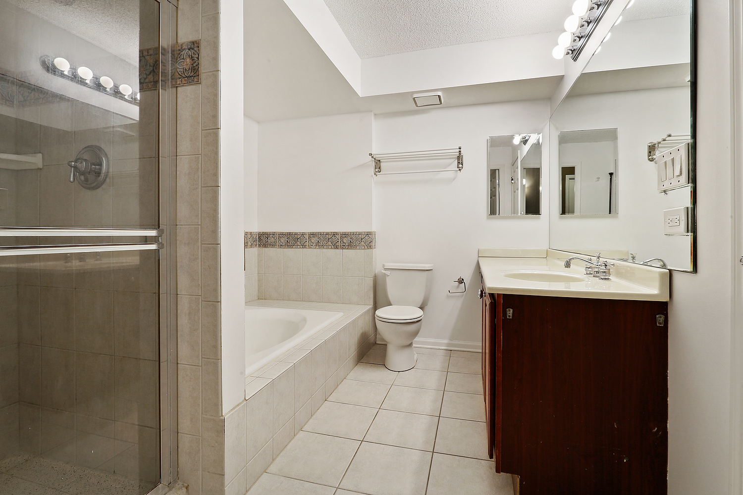 470 Fawell Boulevard, Unit 320 Glen Ellyn, IL 60137 - Photo 9 of 15 a bathroom with a sink a toilet and shower