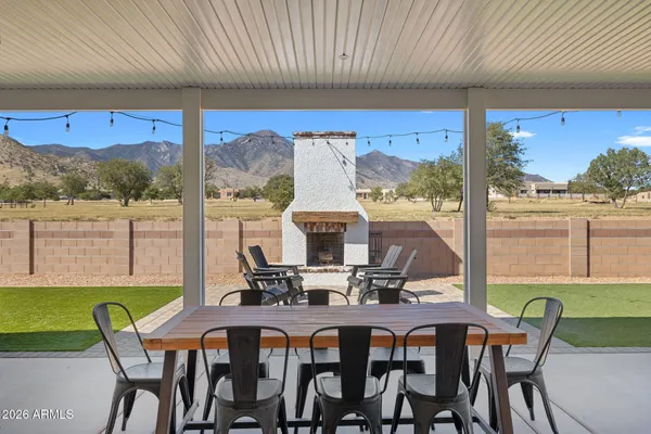 a view of a dining room with furniture window and outside view