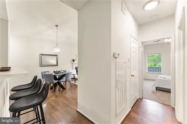 a view of a livingroom with furniture and hardwood floor