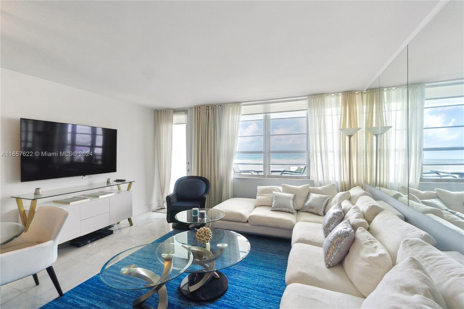 100 Lincoln Road, Unit 1534 Miami Beach, FL 33139 - Photo 3 of 25 a living room with furniture floor and a flat screen tv
