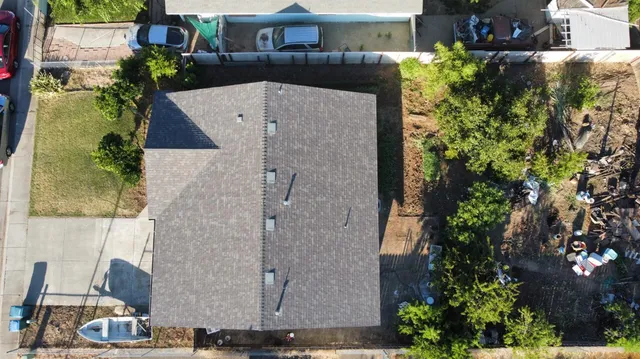 an aerial view of a house with outdoor space