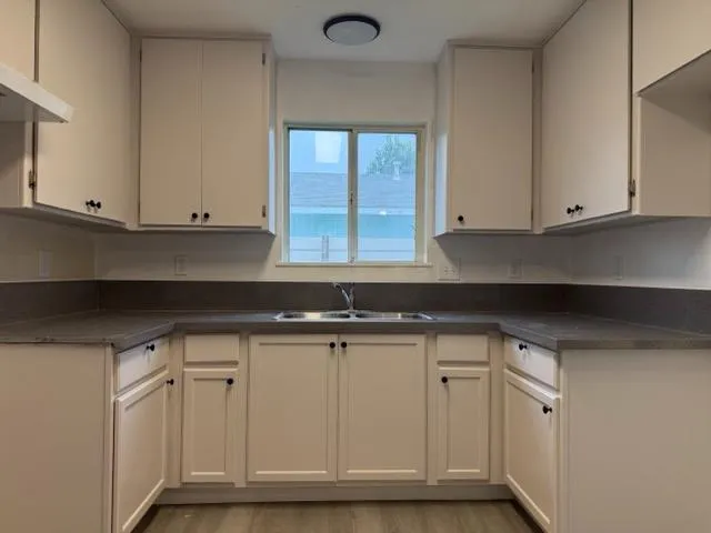 a view of cabinets and window