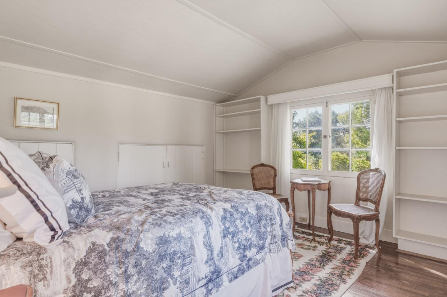 25286 Hatton Road Carmel, CA 93923 - Photo 27 of 34 a bedroom with a bed and a large window
