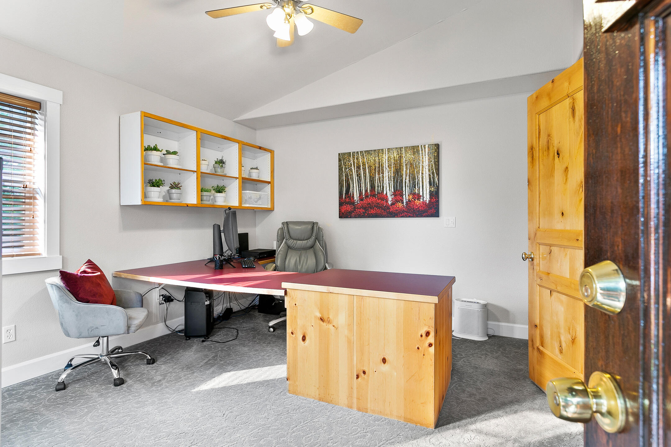 62672 Larkview Road Bend, OR 97701 - Photo 12 of 39 a view of a workspace with furniture and a window
