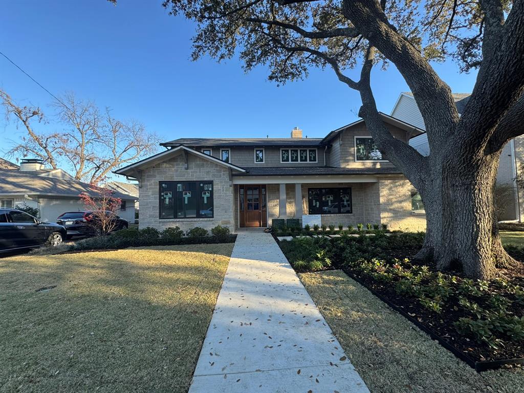 6954 Santa Maria Lane Dallas, TX 75214 - Photo 1 of 5 a front view of a house with a garden and yard